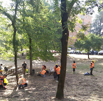 FAAC and HUB volunteers pick up litter from the Reno park in Bologna, Italy