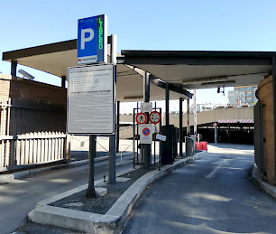 entrance to the ATAC Trastevere parking lot in Rome, with HUB stations and LPR license plate reading cameras.