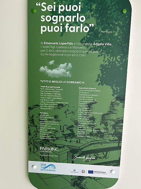 poster in italiano dentro Sant'Isidoro parking